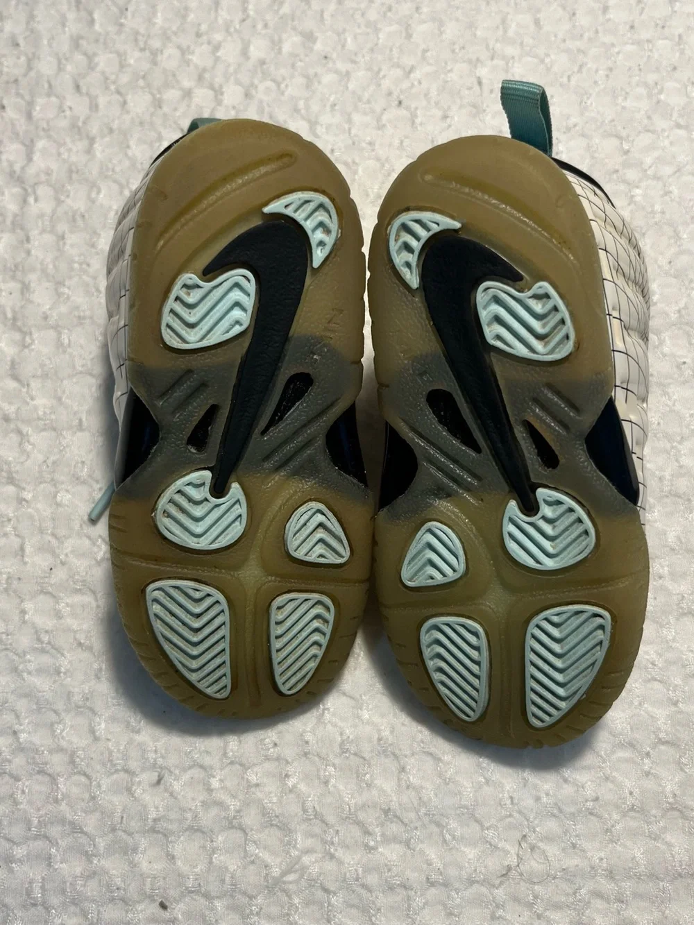 Nike Baby Black and White Grid Wrapped Sneakers with Teal Accents